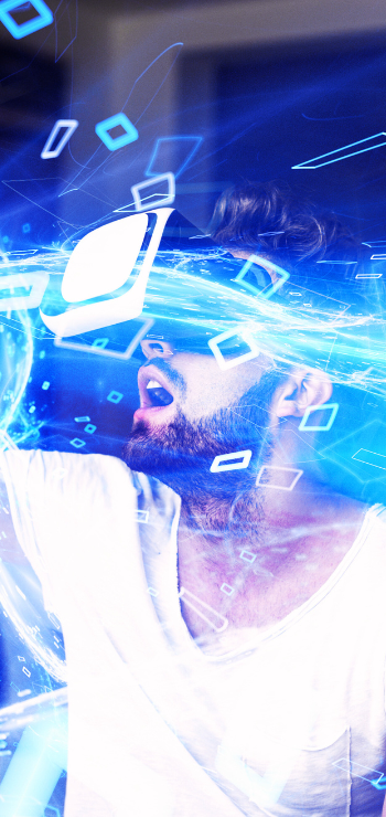 Man in VR headset immersed in a digital world, surrounded by glowing blue effects and virtual data symbols.