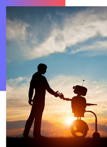 Silhouette of a person shaking hands with a robot under a vibrant sunset sky.
