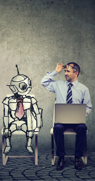 A man in a shirt and tie sits beside a cartoon robot on chairs, with a laptop on his lap, adjusting his glasses, conveying curiosity and surprise.