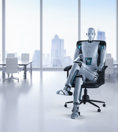 A humanoid robot sits confidently in a modern office chair against a bright, spacious office backdrop. Large windows reveal a cityscape view, conveying a futuristic business setting.